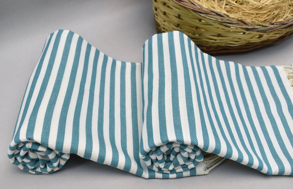 Blue and white striped 100% organic cotton Turkish Towel on display