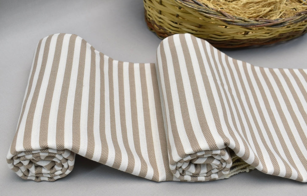 Brown and white striped 100% organic cotton Turkish Towel on display