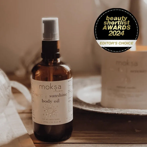 organic body oil in an amber bottle 