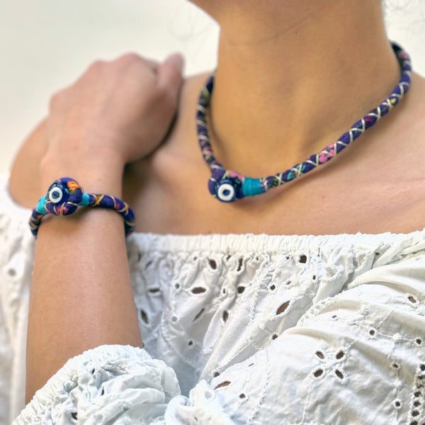 Purple handmade bracelet with evil eye bead detail