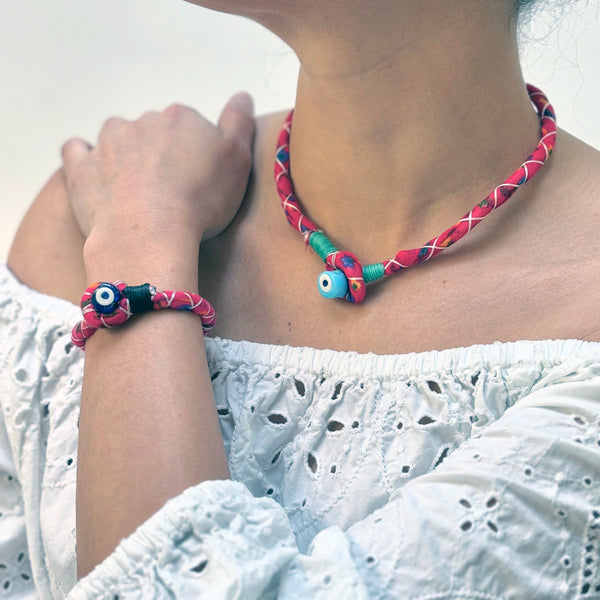 Red handmade bracelet with evil eye bead detail