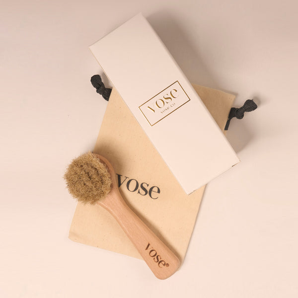 Natural and organic horse hair face brush on display with its cotton pouch and packaging