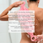 A person from behind using a pink scrubbing mitt on their back during a shower, with white text overlays detailing the product's features and benefits.