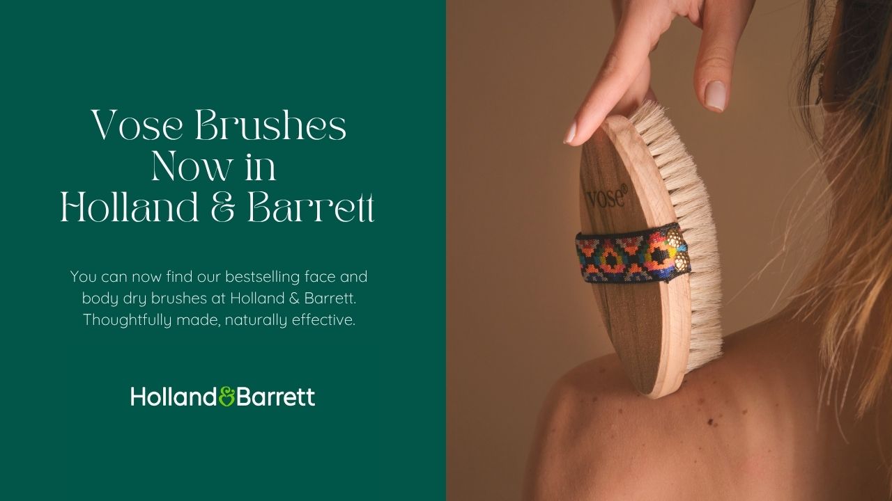 Promotional image for Vose Brushes at Holland & Barrett with a brush held by a hand.